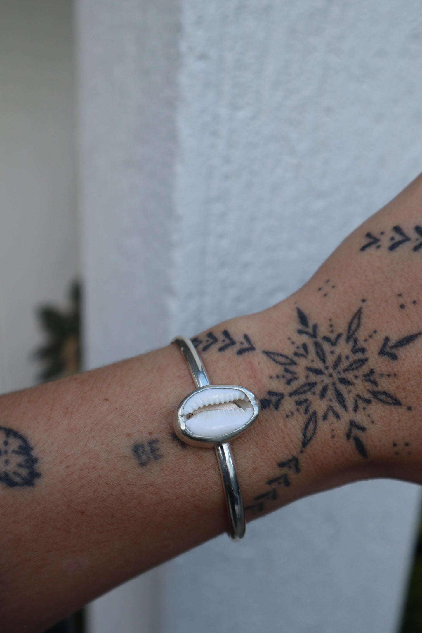 Cowrie shell cuff
