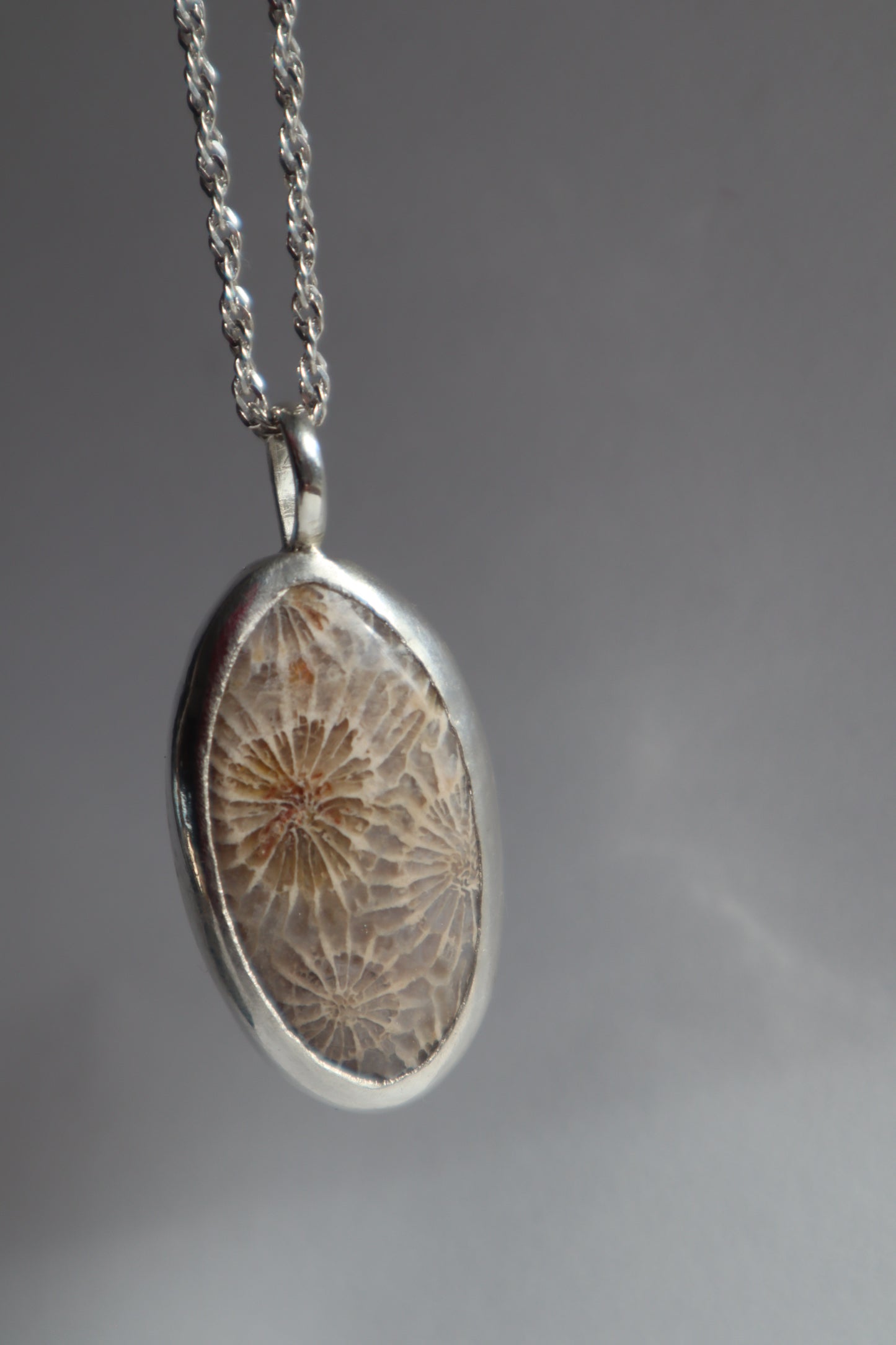 Fossilised coral pendant